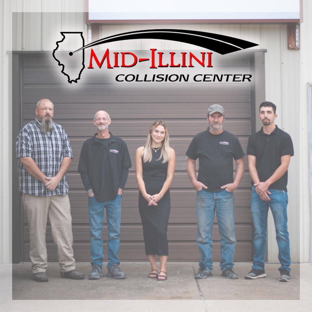 Collision Repair Shop in Pekin, IL Five people stand in front of a garage door under a "Mid-Illini Collision Center" sign.